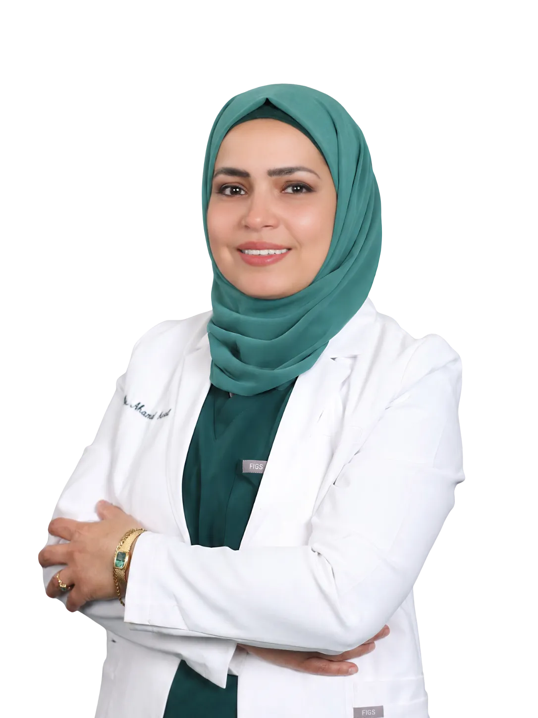 Dr. Manal Ismail, DDS, in her white coat