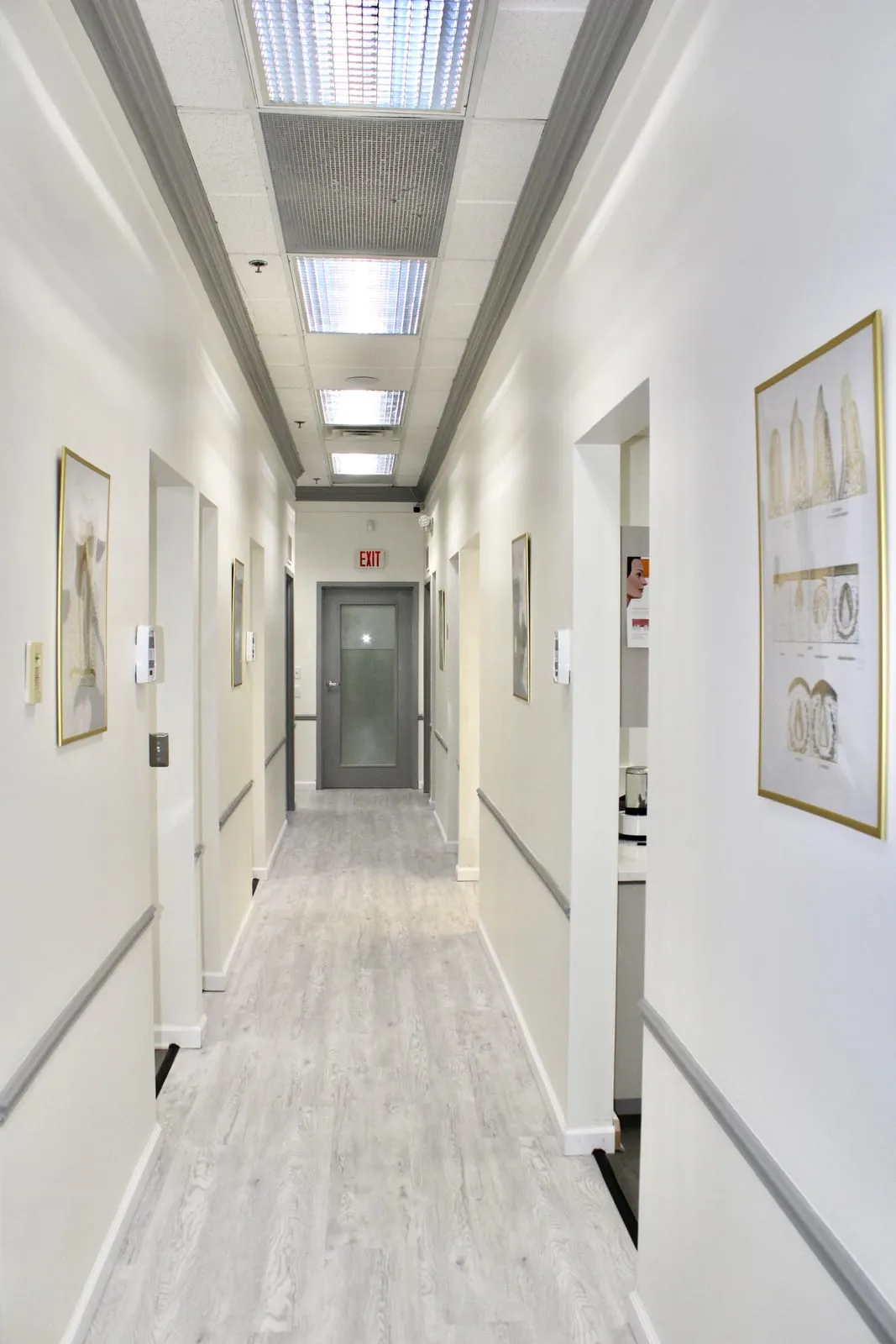 A bright, clean hallway leading to the treatment rooms at Royal Dental Center